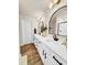 Elegant bathroom featuring double vanity sinks, modern fixtures, and a walk-in shower at 716 Mcroy St, Moncks Corner, SC 29461