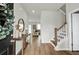 Inviting entryway with wood floors, stairs, and a glimpse into the living room at 716 Mcroy St, Moncks Corner, SC 29461