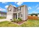 Charming home with a well-kept lawn, landscaping, and a welcoming front entrance at 716 Mcroy St, Moncks Corner, SC 29461