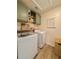 A laundry room featuring wooden cabinets, a washer and dryer at 716 Mcroy St, Moncks Corner, SC 29461