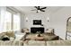 Inviting living room with modern decor, a ceiling fan, and ample seating, creating a cozy and stylish atmosphere at 716 Mcroy St, Moncks Corner, SC 29461