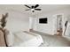 Spacious main bedroom featuring neutral walls, wall-mounted tv, and a view of the ensuite bathroom at 716 Mcroy St, Moncks Corner, SC 29461
