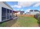 Spacious backyard with screened in porch, patio and fenced perimeter at 7302 Sanderling Ct, Hanahan, SC 29410