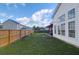 A fenced backyard with a spacious lawn and patio at 7302 Sanderling Ct, Hanahan, SC 29410