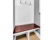 A white wood entryway bench with coat hooks and a stained wood top against gray walls and light floors at 7302 Sanderling Ct, Hanahan, SC 29410