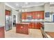 Well-appointed kitchen featuring wooden cabinets, granite countertops, stainless steel appliances, and ample storage space at 7302 Sanderling Ct, Hanahan, SC 29410