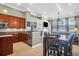 Gourmet kitchen boasting granite countertops, stainless steel appliances, and open views to the dining and living areas at 7302 Sanderling Ct, Hanahan, SC 29410