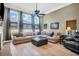 Spacious living room with large windows, comfortable seating, and modern decor at 7302 Sanderling Ct, Hanahan, SC 29410