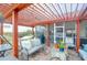 Outdoor pergola with pavers, lights, outdoor sofa and grill at 7302 Sanderling Ct, Hanahan, SC 29410