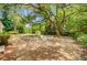 Expansive backyard with seating area, playset, shed, and mature landscaping at 734 Fort Sumter Dr, Charleston, SC 29412
