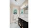Bathroom featuring a glass-enclosed shower, modern vanity, and stylish fixtures over black and white tile at 734 Fort Sumter Dr, Charleston, SC 29412