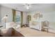 Bedroom featuring a white crib, cozy armchair, whimsical decor, and natural light filtering through a window at 734 Fort Sumter Dr, Charleston, SC 29412