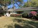 Charming home with blooming azaleas and manicured lawn enhances curb appeal at 734 Fort Sumter Dr, Charleston, SC 29412