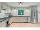 Well-lit kitchen with stainless steel appliances, a gas range, and plenty of cabinet storage for a functional cooking space at 734 Fort Sumter Dr, Charleston, SC 29412