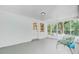 Bright sunroom with white brick, screened windows, and views of backyard at 734 Fort Sumter Dr, Charleston, SC 29412