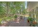 Secluded back deck with outdoor dining space and lush greenery, ideal for enjoying the outdoors at 803 Burnett Dr, Charleston, SC 29412