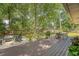 Expansive wooden deck with a fire pit, lounge seating, and an outdoor dining area at 803 Burnett Dr, Charleston, SC 29412