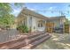 Back of house with wooden deck and multiple seating and cooking spaces at 803 Burnett Dr, Charleston, SC 29412