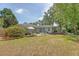 Spacious backyard with lounge area, wooden deck and stock tank pool perfect for outdoor enjoyment at 803 Burnett Dr, Charleston, SC 29412