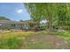 Large backyard with deck, pool, lounge area, hammock, and lush landscaping for outdoor entertaining at 803 Burnett Dr, Charleston, SC 29412
