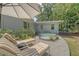 Relaxing backyard scene with stock tank pool, lounge chairs, and a shady umbrella for ultimate relaxation at 803 Burnett Dr, Charleston, SC 29412