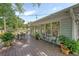 Wooden deck with dining and bistro sets, surrounded by lush landscaping at 803 Burnett Dr, Charleston, SC 29412