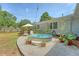 Charming backyard features a unique stock tank pool, lounge chairs, and lush greenery for a serene retreat at 803 Burnett Dr, Charleston, SC 29412