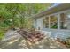 Back of house with wooden deck and steps leading down to a gravel patio at 803 Burnett Dr, Charleston, SC 29412
