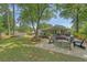 Expansive backyard with deck, lounge areas, hammock, and lush landscaping for endless outdoor enjoyment at 803 Burnett Dr, Charleston, SC 29412