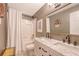 Bathroom featuring a double sink vanity with marble countertop and tub with shower at 803 Burnett Dr, Charleston, SC 29412