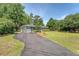 Beautiful home featuring an attached garage, driveway, manicured lawn and lush landscaping at 803 Burnett Dr, Charleston, SC 29412