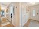 Neutral hallway with hardwood floors and white doors leading to various rooms in the home at 803 Burnett Dr, Charleston, SC 29412