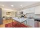 Bright, eat-in kitchen featuring white cabinets, stainless appliances, and a center island at 803 Burnett Dr, Charleston, SC 29412