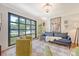 Cozy living room features a large window, stylish seating, and a decorative chandelier at 803 Burnett Dr, Charleston, SC 29412