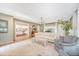 Cozy living room with neutral furniture, hardwood floors, area rug and view into the kitchen at 803 Burnett Dr, Charleston, SC 29412