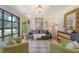 Cozy living room with stylish decor, a large window, and comfortable seating arrangement at 803 Burnett Dr, Charleston, SC 29412