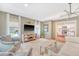 Bright living room with a shaggy rug, modern lighting and view to the kitchen at 803 Burnett Dr, Charleston, SC 29412