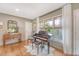 Cozy corner of the living room with a piano, a window, and hardwood floors at 803 Burnett Dr, Charleston, SC 29412