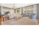 Bright living room with plush rug, neutral furniture, piano, and natural light at 803 Burnett Dr, Charleston, SC 29412