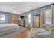 Spacious main bedroom with hardwood floors, a comfortable chair, and ample natural light at 803 Burnett Dr, Charleston, SC 29412