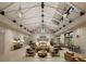 Bright and airy living room featuring high ceilings with exposed beams and modern light fixtures at 827 Gentle Breeze Dr, Summerville, SC 29486