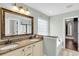 Bathroom with double vanity, granite countertop, a large mirror, and a window overlooking a tub at 911 Hunt Club, Charleston, SC 29414