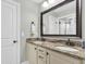 Bathroom featuring double sinks, granite countertops, modern fixtures, and large mirror at 911 Hunt Club, Charleston, SC 29414