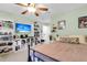 Bedroom with TV, shelving, posters, carpet, ceiling fan, and doorway to another room at 911 Hunt Club, Charleston, SC 29414