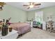 Cozy bedroom with a ceiling fan, carpet, window, and light green walls at 911 Hunt Club, Charleston, SC 29414