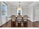 Bright dining room featuring hardwood floors, a stylish light fixture and large window at 911 Hunt Club, Charleston, SC 29414