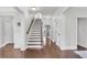 Elegant foyer with hardwood floors, staircase, and white trim throughout, creating a welcoming entrance at 911 Hunt Club, Charleston, SC 29414