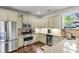 Well-equipped kitchen features stainless steel appliances, granite countertops, and ample cabinet space at 911 Hunt Club, Charleston, SC 29414