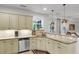 Modern kitchen features a breakfast bar, granite countertops and ample cabinet space at 911 Hunt Club, Charleston, SC 29414