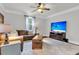 Comfortable living room features a large television, ceiling fan, and leather seating area at 911 Hunt Club, Charleston, SC 29414